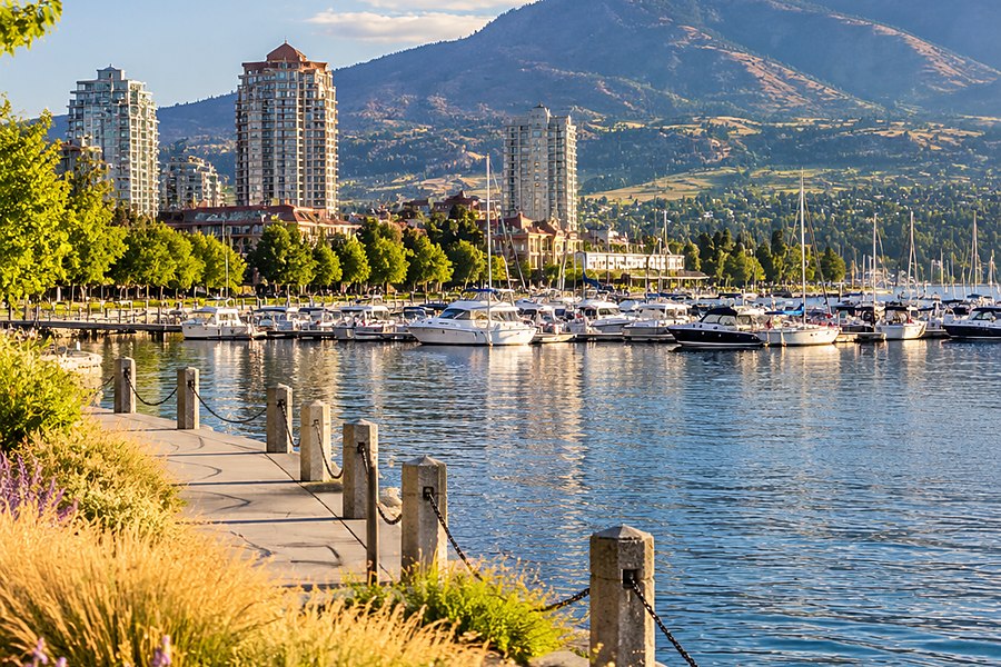 The Kelowna waterfront boardwalk and marina on a summer afternoon